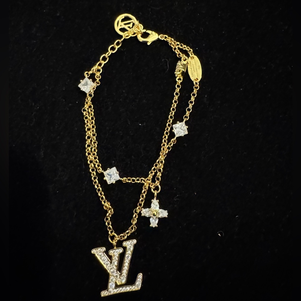 Louis Vuitton Gold and Silver Bracelet with Logo Charms - Picture 1 of 5